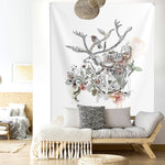 Deer wall tapestry, hanged above sofa in a boho living room
