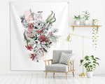 floral wall tapestry, hanged on a white wall above a gray couch
