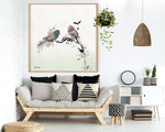 Bird painting framed and hanged above sofa