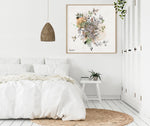 White bedroom space with a boho artwork on the wall