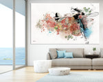 Large canvas painting above a sofa with pillows