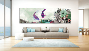 A koi fish painting with colors of green and purple, above a large gray sofa