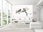 White living room with a large painting on the wall of love birds standing on a branch