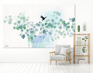 Turquoise watercolor painting of leaves and black bird - Liz Kapiloto Art & Design Large canvas painting of turquoise leaves, hanging on a white wall