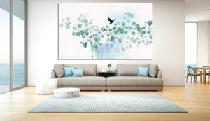 Nordic wall art of turquoise watercolor leaves, hanged in a modern living room above the sofa
